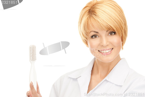 Image of doctor with toothbrush