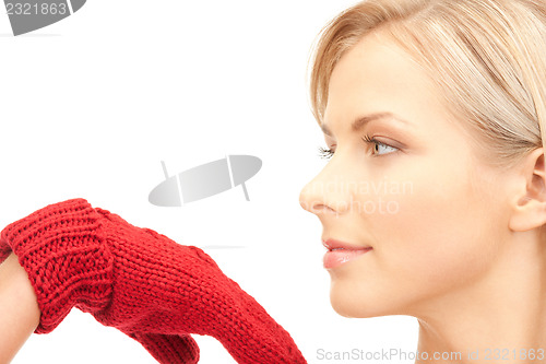 Image of beautiful woman in red mittens