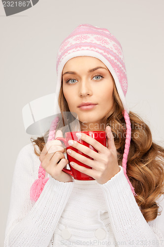 Image of beautiful woman with red mug