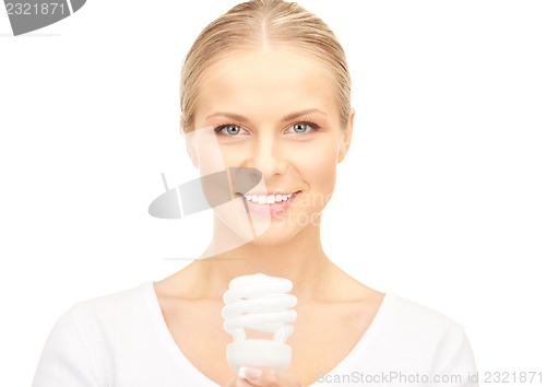 Image of woman holding energy saving bulb