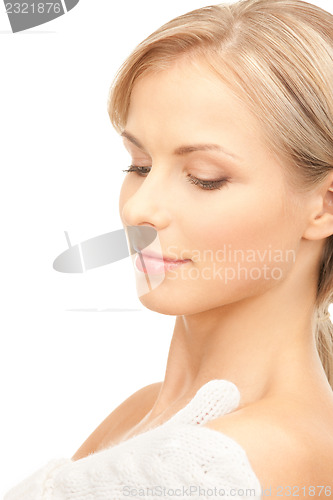 Image of beautiful woman in white mittens