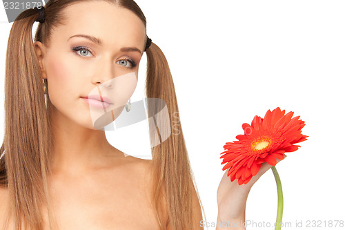 Image of lovely woman with red flower