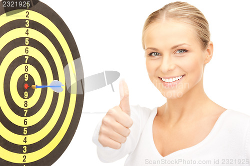 Image of businesswoman with dart and target