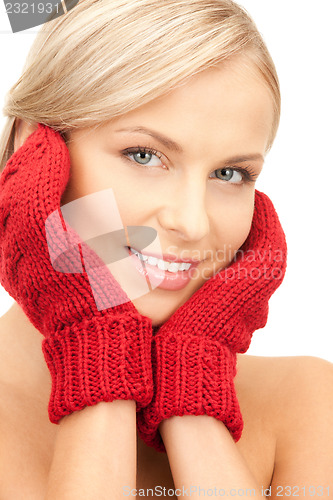 Image of beautiful woman in red mittens