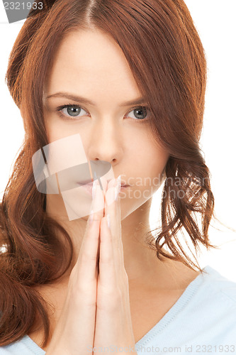 Image of praying businesswoman