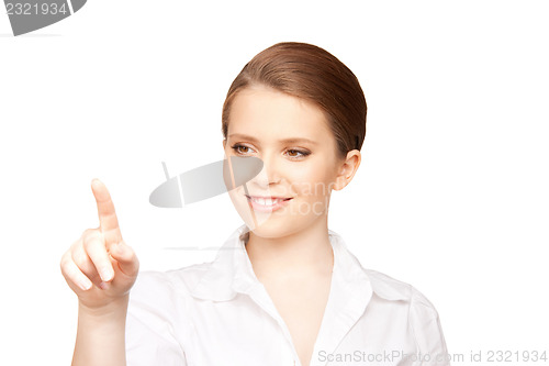 Image of businesswoman working with something imaginary