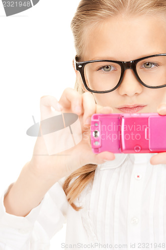 Image of happy girl taking picture with cell phone