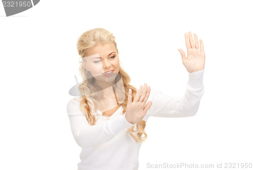 Image of businesswoman working with something imaginary