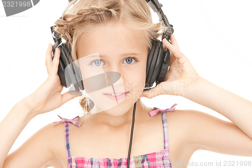 Image of happy girl in big headphones