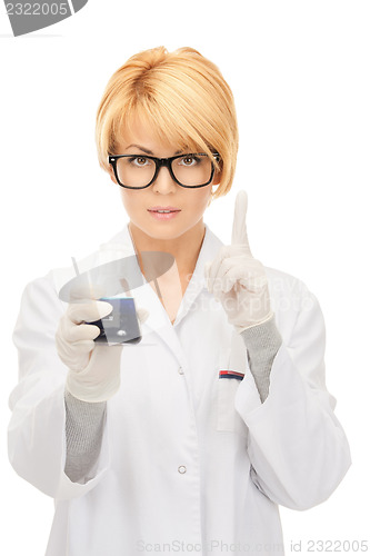 Image of lab worker holding up test tube