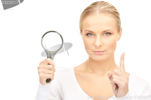 Image of woman with magnifying glass