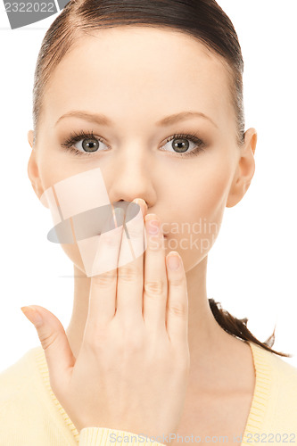 Image of hand over mouth
