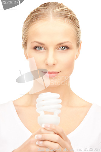 Image of woman holding energy saving bulb