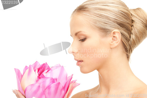 Image of beautiful woman with white flower