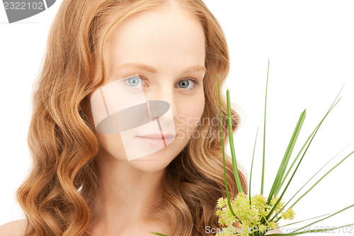 Image of woman with green sprout