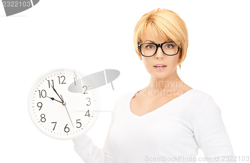 Image of woman holding big clock