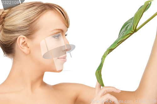 Image of woman with green leaf