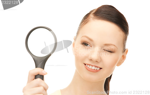 Image of  woman with magnifying glass	 