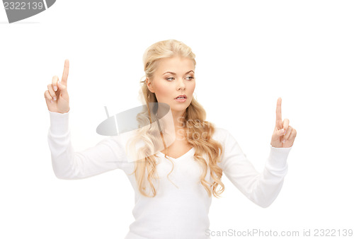 Image of businesswoman working with something imaginary