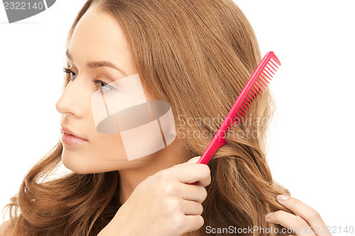 Image of beautiful woman with comb