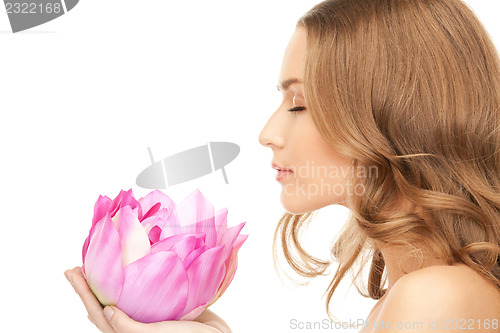 Image of beautiful woman with lotus flower