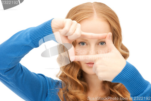 Image of lovely woman creating a frame with fingers