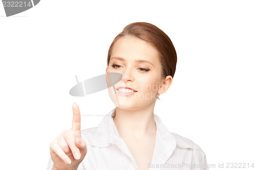 Image of businesswoman working with something imaginary