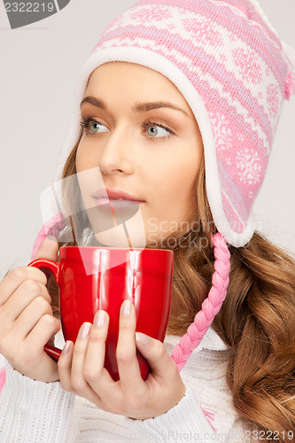 Image of beautiful woman with red mug