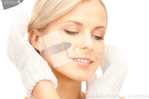 Image of beautiful woman in white mittens