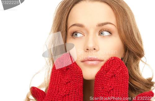 Image of beautiful woman in red mittens