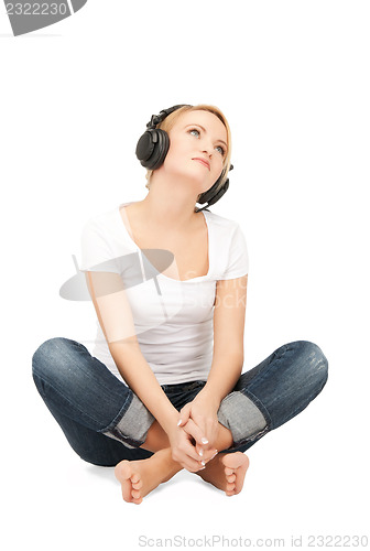 Image of  happy teenage girl in big headphones