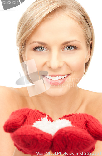 Image of beautiful woman in red mittens with snow