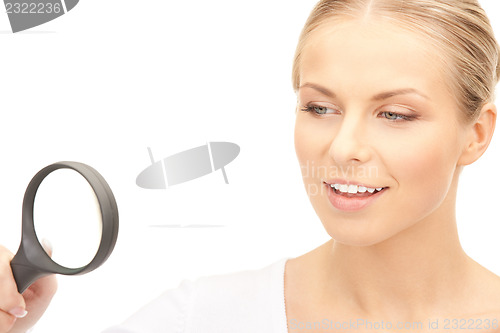 Image of woman with magnifying glass