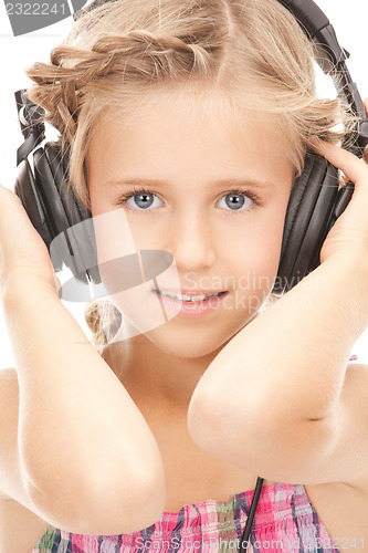 Image of happy girl in big headphones