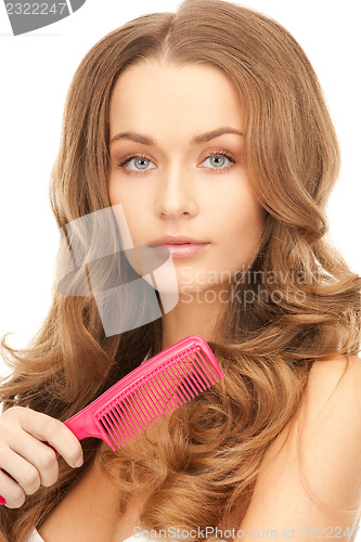 Image of beautiful woman with comb
