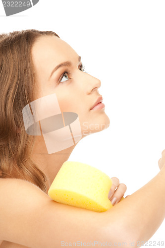 Image of beautiful woman with sponge