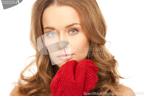 Image of beautiful woman in red mittens