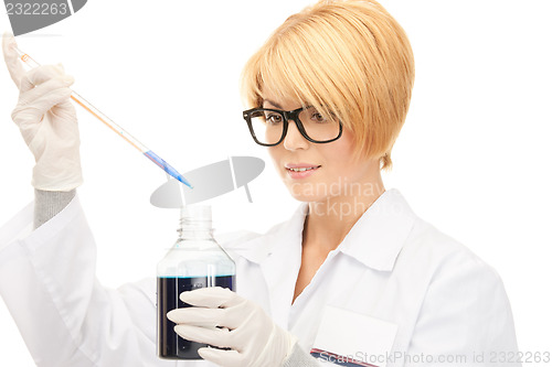 Image of lab worker holding up test tube