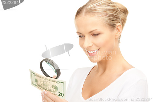 Image of woman with magnifying glass and money