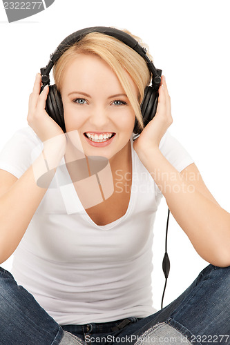 Image of  happy teenage girl in big headphones