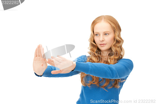 Image of businesswoman working with something imaginary