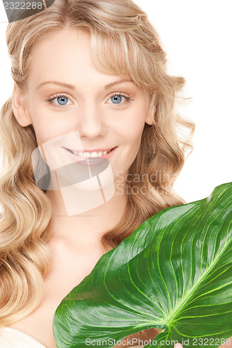 Image of woman with green leaf