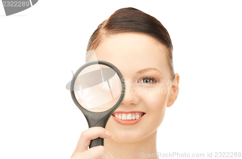 Image of  woman with magnifying glass	 