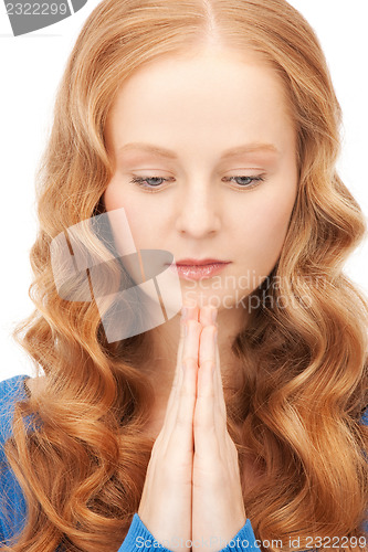 Image of praying businesswoman