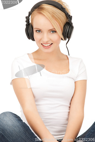 Image of  happy teenage girl in big headphones