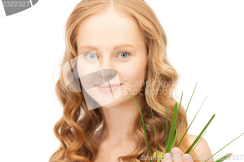 Image of woman with green sprout