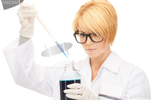 Image of lab worker holding up test tube