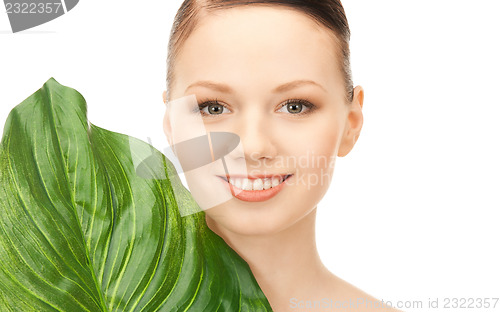 Image of woman with green leaf