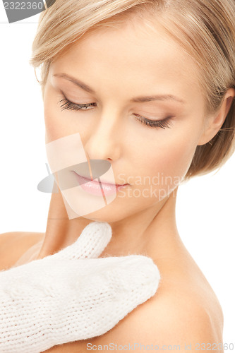 Image of beautiful woman in white mittens