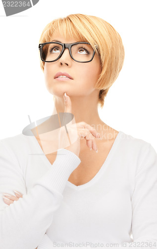 Image of pensive businesswoman over white